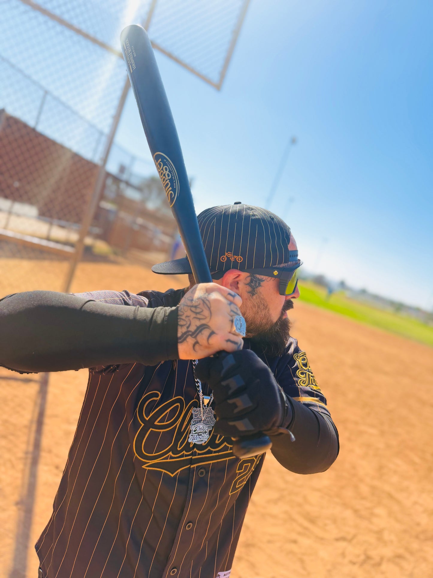 The OG Slugger Pinstriped Baseball Jersey (Black/Gold)