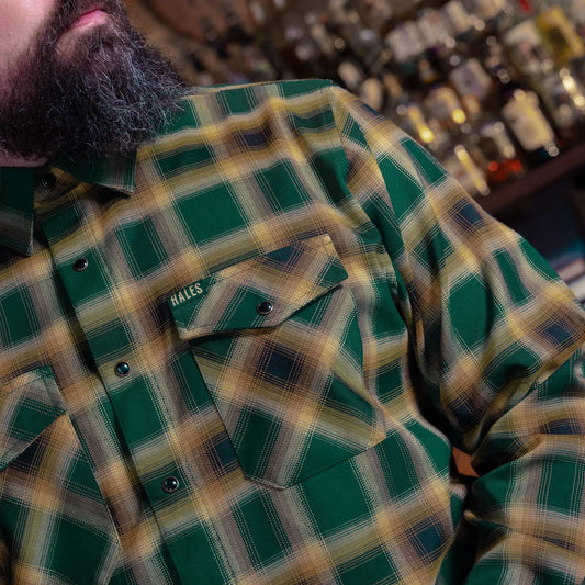 The Dubliner Men’s Flannel is more than just a shirt—it’s a tribute to the rich legacy of Guinness. Crafted with bold green and black tones, accented by fiery bright accents, this flannel channels the essence of Dublin’s iconic brew. Whether you’re raising a pint at the pub or just embracing the boldness of life, this flannel’s deep colors and premium craftsmanship will have you standing out, just like the Guinness stout that inspired it.