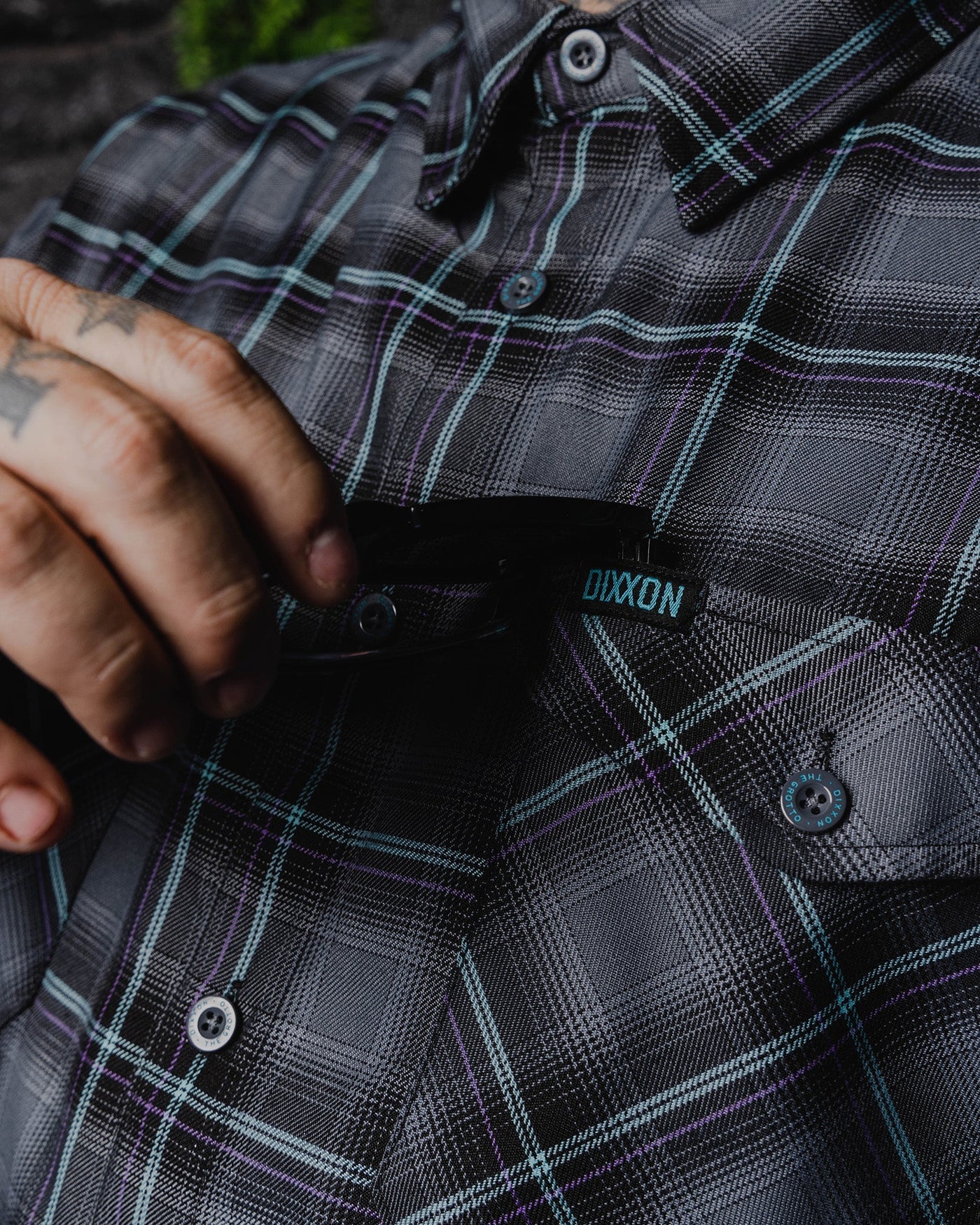 The FIFTH Flannel of the 6 Part Dancun Series, The Grotto Flannel features an allover black, gray, aqua blue, and purple plaid pattern that offers a clean and classic design, while our signature D-Tech™ blend provides the comfort of soft to the touch flannel. Constructed to be breathable for the performance you demand, yet durable for the rugged lifestyle you live.