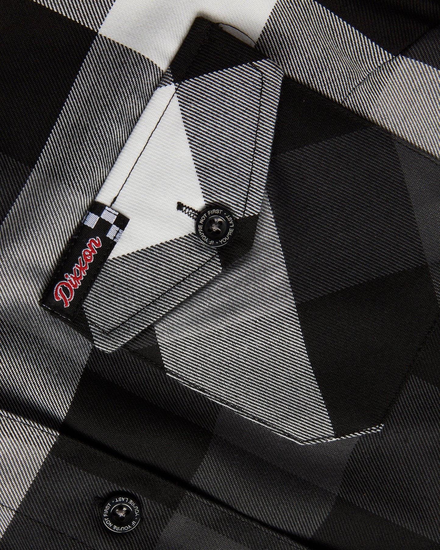 The Finish Line Flannel for Men.
Additional Info:
Men’s grey, white, and black plaid patterned flannel shirt
Machine wash cold with like colors
Hang to dry or tumble dry on low
Do not iron
Signature D-Tech™ polyester blend
Imported