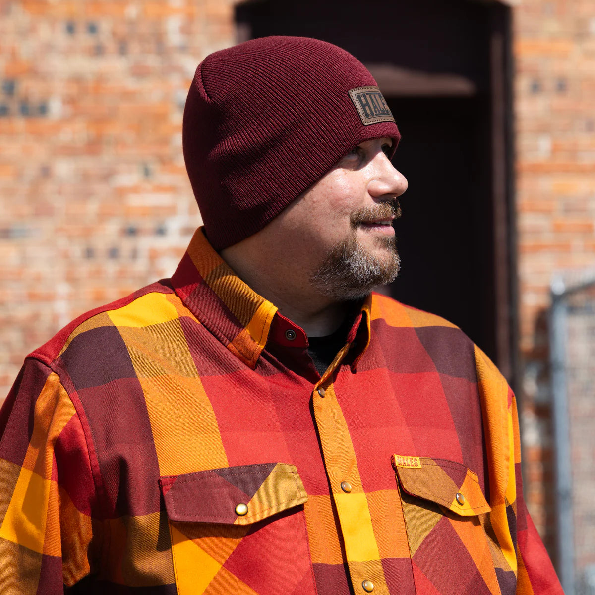 Worn by lawmen, cowboys, and outlaws alike, our "Sheriff" flannel guarantees a stylish and sharp look that will outlast your day! This long-sleeve pearl snap shirt features a timeless plaid pattern and the same unbeatable comfort of Hales Legendary Flannels that you already know and love. With a modern twist on a traditional western shirt, it boasts vibrant colors and our exclusive poly/spandex blend for ultimate comfort, making it an essential for any contemporary cowboy. The vibrant golden pearl snaps