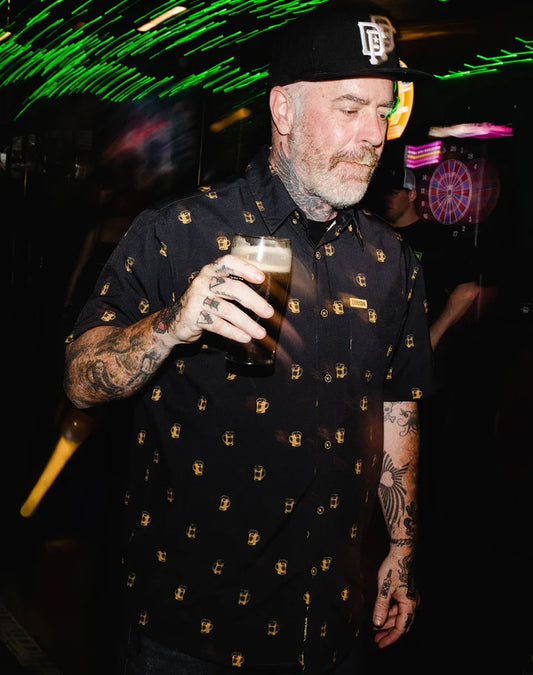 Add some Irish vibes to an everyday essential with the Scuttered Short Sleeve. Constructed with an easy fluid fabric, this button up party shirt was designed for a comfortable and laid-back wear. Soft and lightweight with a shrink and wrinkle resistant finish, the Scuttered is a must-have for anyone looking to have a good time!