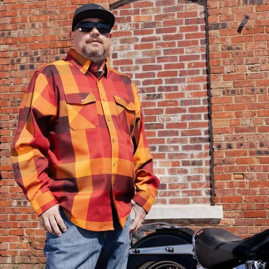 Worn by lawmen, cowboys, and outlaws alike, our "Sheriff" flannel guarantees a stylish and sharp look that will outlast your day! This long-sleeve pearl snap shirt features a timeless plaid pattern and the same unbeatable comfort of Hales Legendary Flannels that you already know and love. With a modern twist on a traditional western shirt, it boasts vibrant colors and our exclusive poly/spandex blend for ultimate comfort, making it an essential for any contemporary cowboy. The vibrant golden pearl snaps