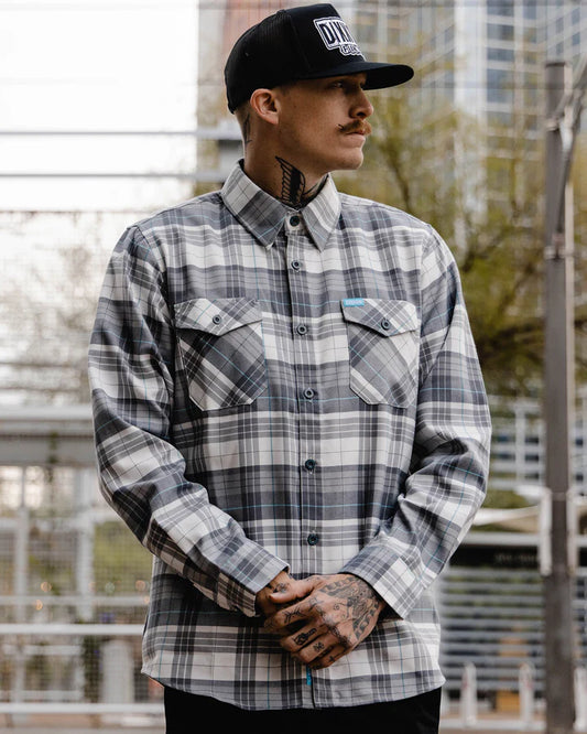 Inspired by the hustle and bustle of the big city, the Soho Flannel features an allover gray, white, and aqua blue plaid pattern that offers a clean and classic design, while our signature D-Tech™ blend provides the comfort of soft to the touch flannel. Constructed to be breathable for the performance you demand, yet durable for the rugged lifestyle you live.