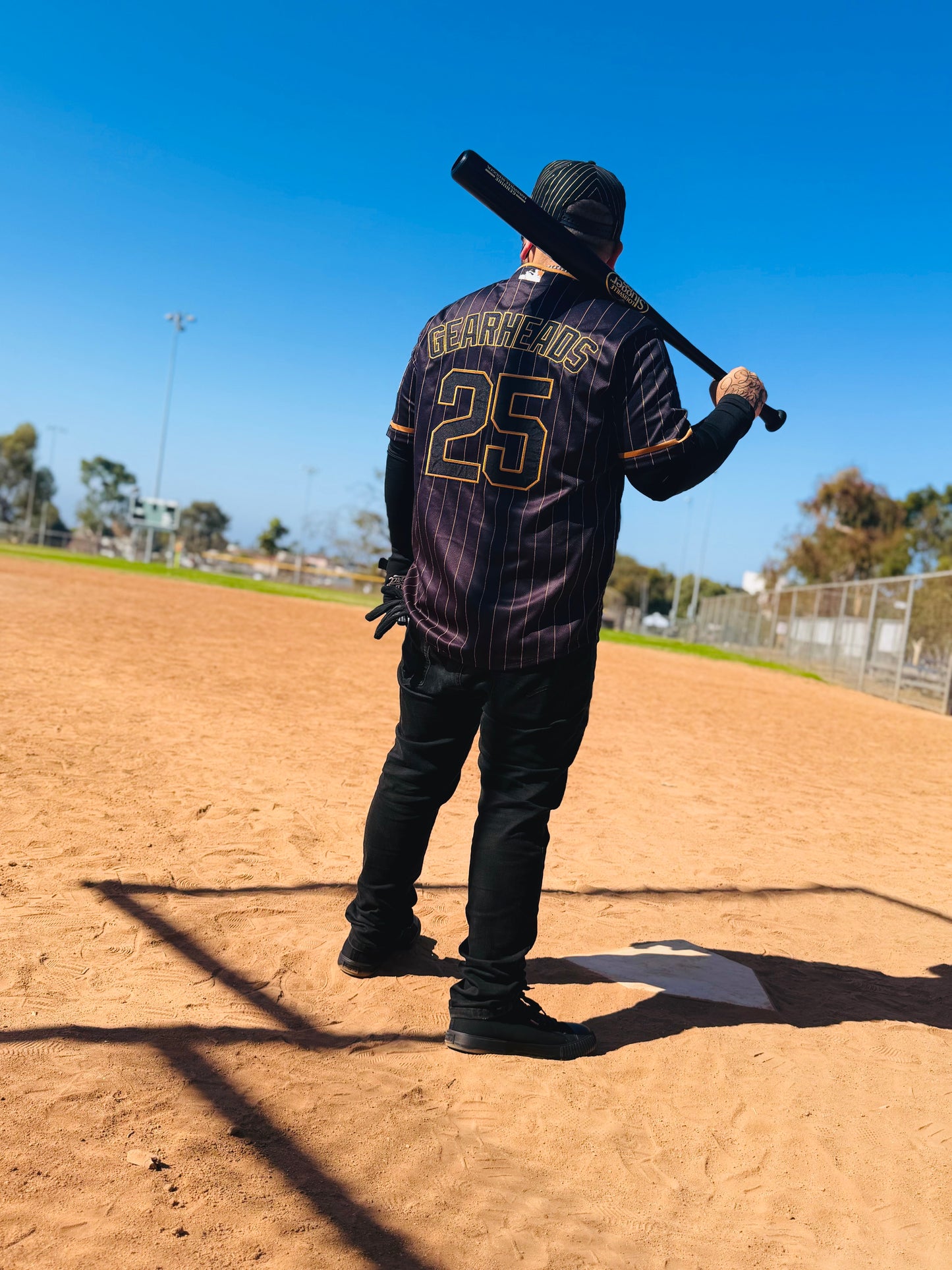 The OG Slugger Pinstriped Baseball Jersey (Black/Gold)