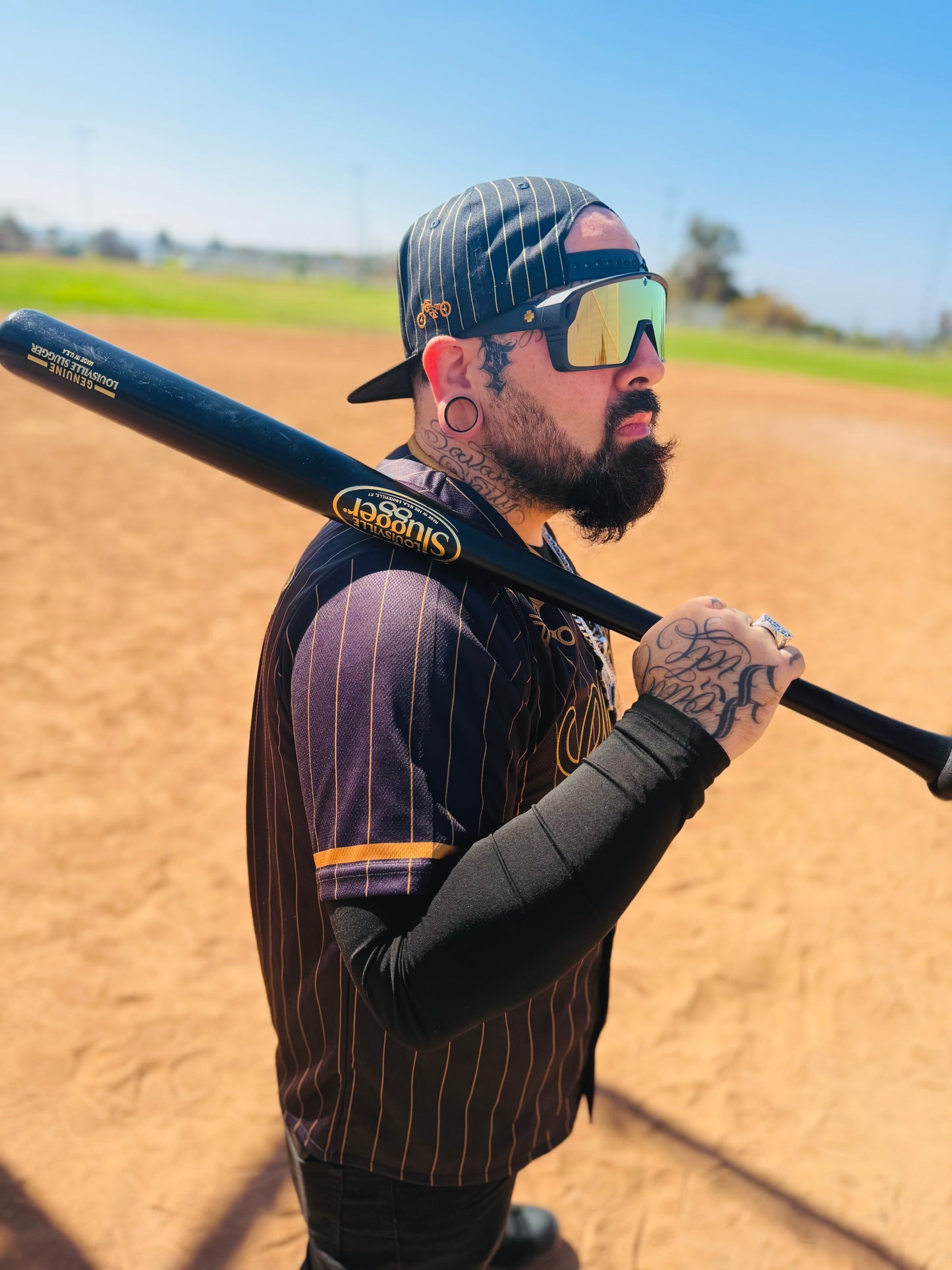 The OG Slugger Pinstriped Baseball Jersey (Black/Gold)