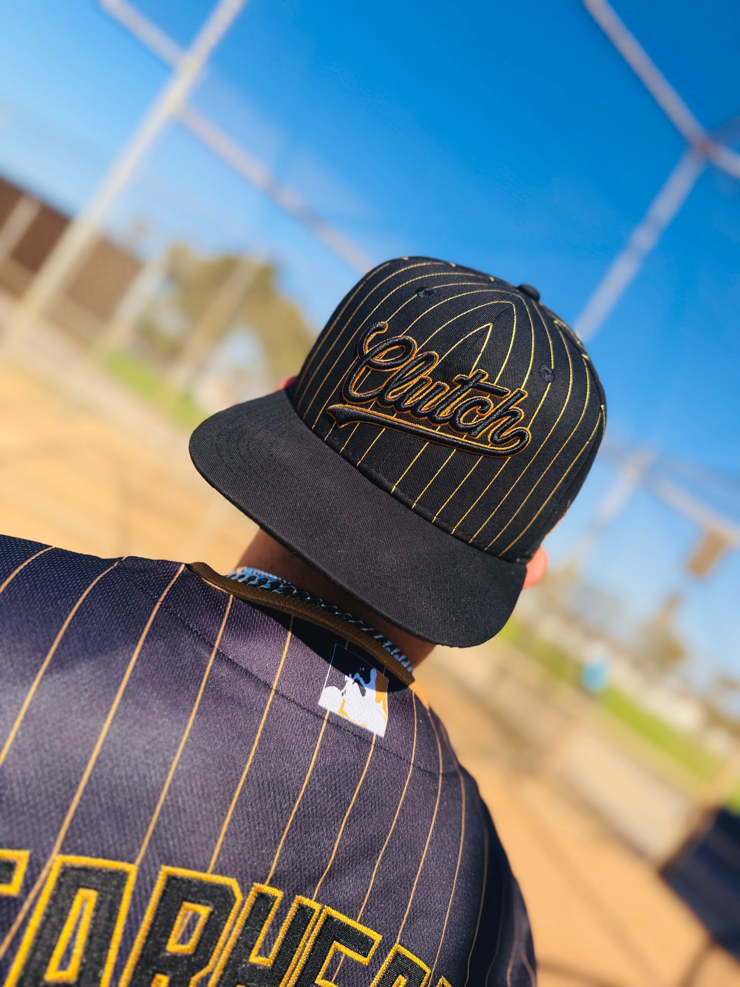 The OG Slugger Pinstriped Baseball Jersey (Black/Gold)