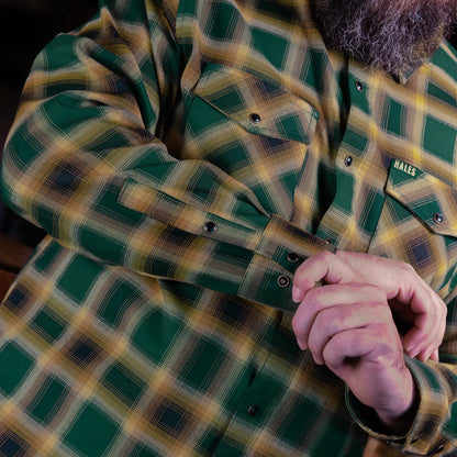 The Dubliner Men’s Flannel is more than just a shirt—it’s a tribute to the rich legacy of Guinness. Crafted with bold green and black tones, accented by fiery bright accents, this flannel channels the essence of Dublin’s iconic brew. Whether you’re raising a pint at the pub or just embracing the boldness of life, this flannel’s deep colors and premium craftsmanship will have you standing out, just like the Guinness stout that inspired it.